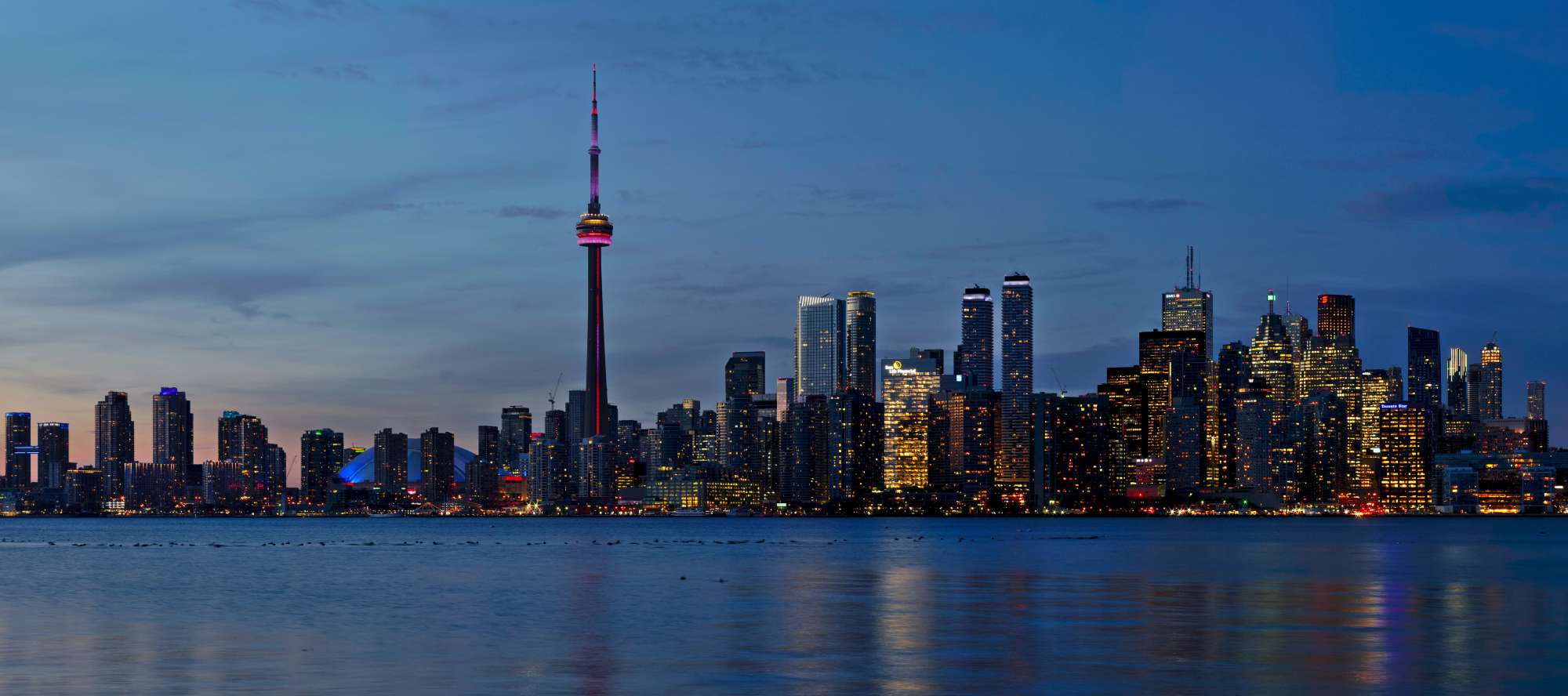 jochem-raat-s0grRYEDaL4-unsplash High-res panorama of the Toronto skyline taken from the Toronto Islands.