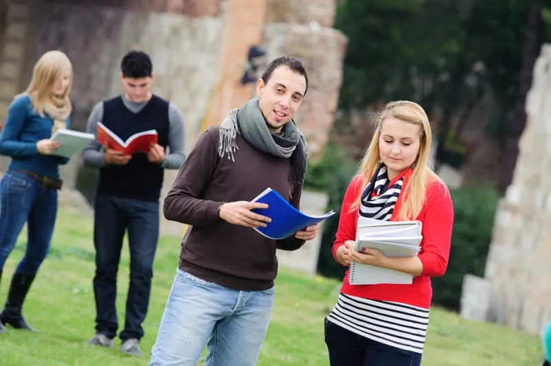 Multicultural,College,Students,At,Park,tuscany,italy Two men shaking hands